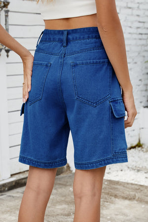 Medium wash denim utility shorts with cargo pockets and a relaxed fit.