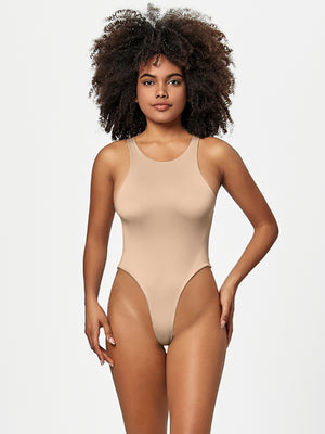 Tan sculpted tank bodysuit with high-cut legs and a racerback.