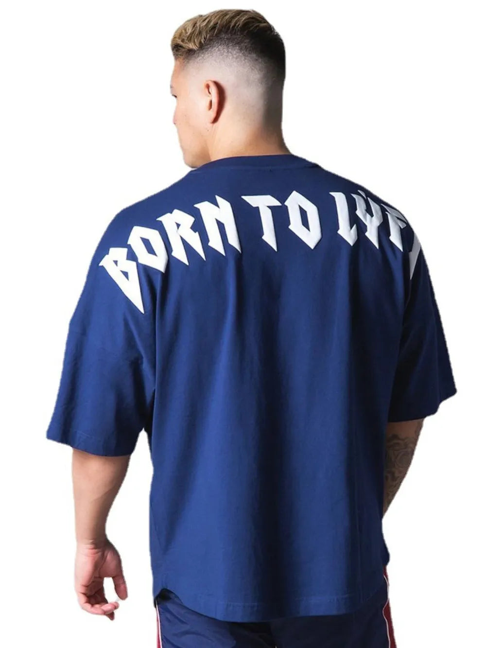 Royal blue oversized tee with white graphic text on back