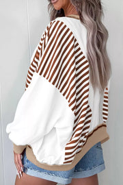 Chic colorblock sweatshirt with brown stripes and contrast stitching, relaxed fit.
