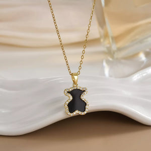 Black bear pendant necklace with gold-plated chain and crystal accents