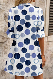 Chic blue polka dot mini dress with flounce sleeves and a-line cut.