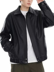 Black faux leather bomber jacket with a collared neckline and elasticized cuffs and hem.