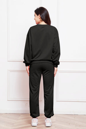 Black relaxed fit loungewear set with crewneck sweatshirt and sweatpants.