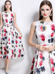White a-line midi dress with a colorful floral print, sleeveless, round neck, and pleated skirt.