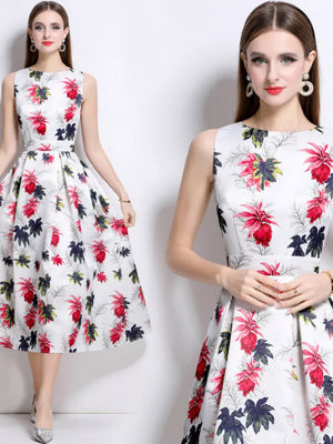 White a-line midi dress with a colorful floral print, sleeveless, round neck, and pleated skirt.