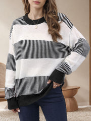 Nautical stripe knit crewneck sweater in black and white, with ribbed cuffs and neckline.