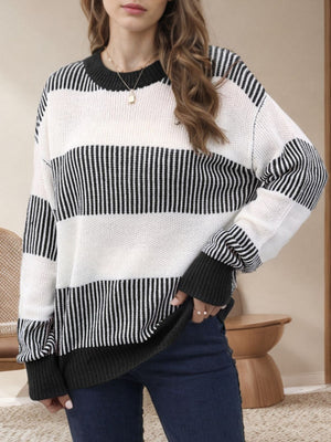 Nautical stripe knit crewneck sweater in black and white, with ribbed cuffs and neckline.
