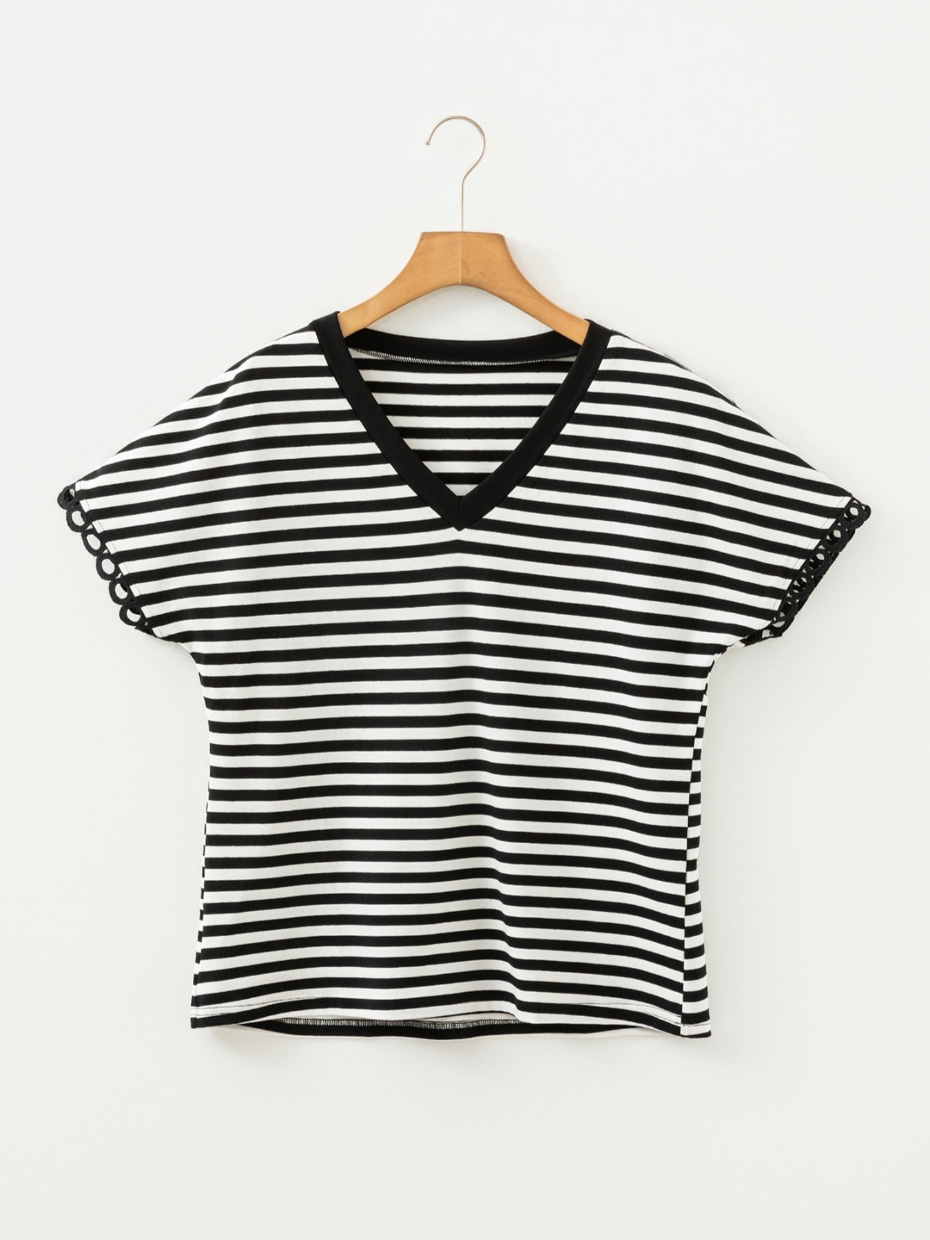 Classic striped V-neck t-shirt in black and white cotton with scalloped sleeve detail.