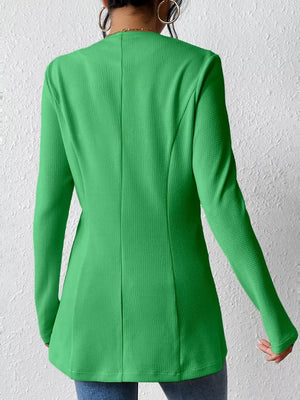 Green single-button blazer with tailored fit and textured fabric.