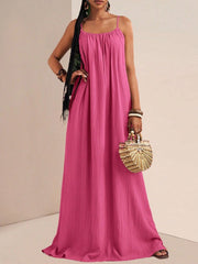 Fuchsia pink maxi swim dress with spaghetti straps and ruched bodice.