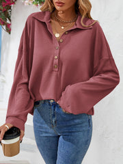 Waffle knit henley blouse in cerise with button collar and long sleeves