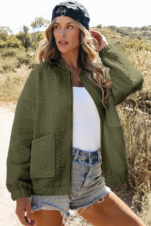 Moss quilted bomber jacket with floral pattern, zip front, and pocket details.