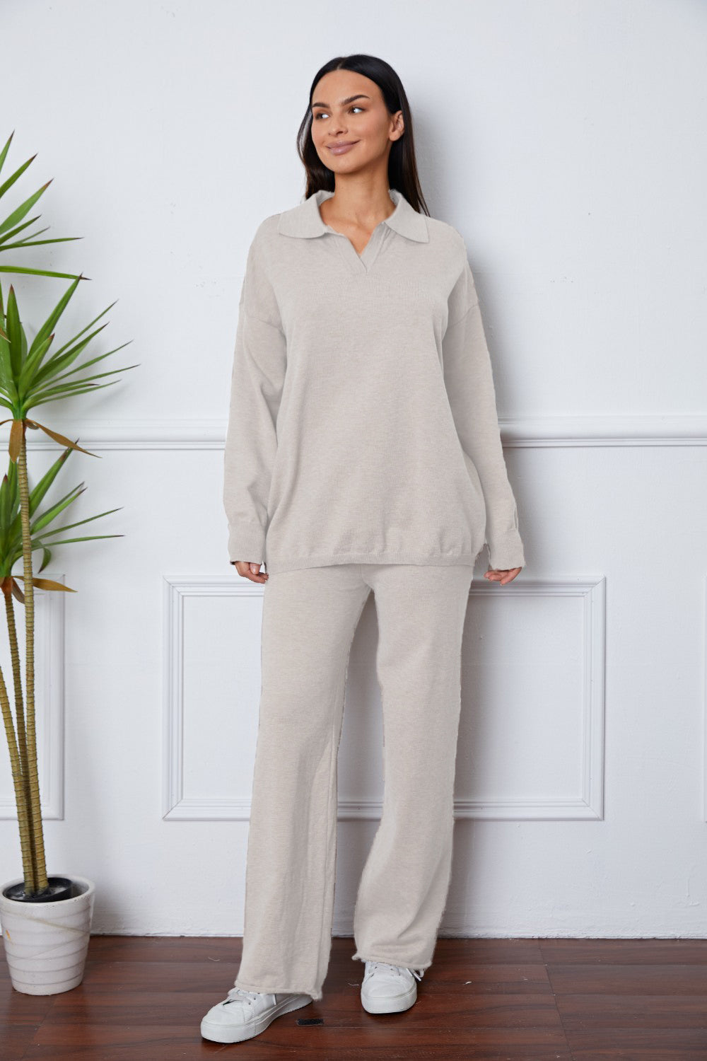 Relaxed knit polo co-ord set in ivory with long sleeves and wide leg pants.