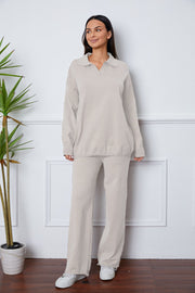 Relaxed knit polo co-ord set in ivory with long sleeves and wide leg pants.