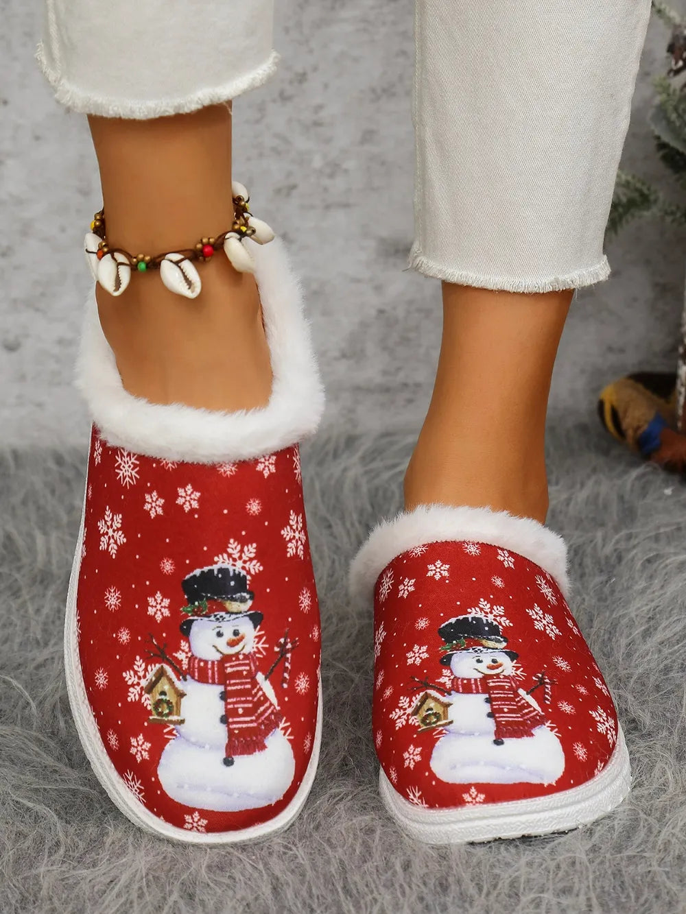 Red snowman print sherpa lined holiday slides with snowflake pattern