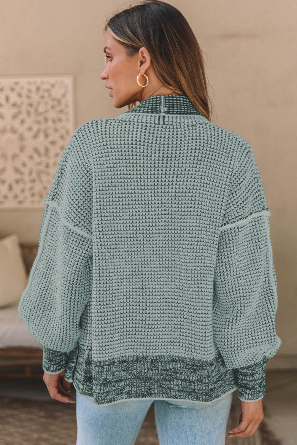Textured open-front knit cardigan in Gum Leaf with contrasting dark trim and balloon sleeves.