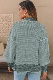 Textured open-front knit cardigan in Gum Leaf with contrasting dark trim and balloon sleeves.