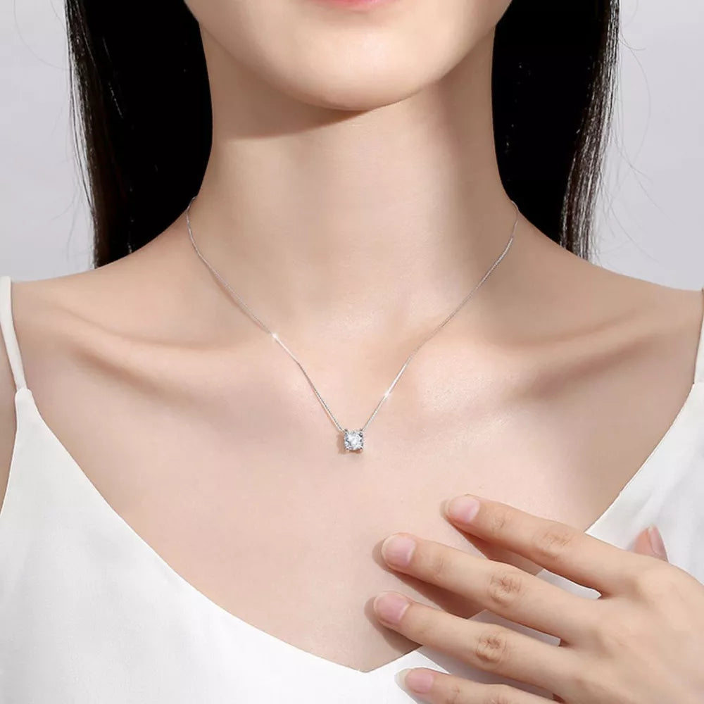 Dazzling moissanite pendant necklace in silver with a delicate chain.