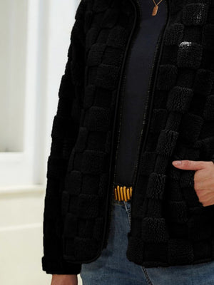 Black textured grid zip-up jacket with a plush feel and casual cut.