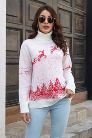 White turtleneck sweater with red reindeer and trees pattern, acrylic knit.