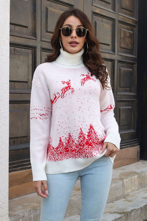 White turtleneck sweater with red reindeer and trees pattern, acrylic knit.