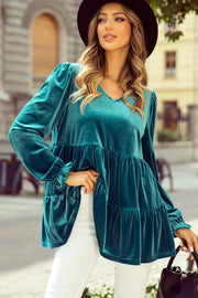 Turquoise velvet tiered blouse with puffed sleeves and v-neck