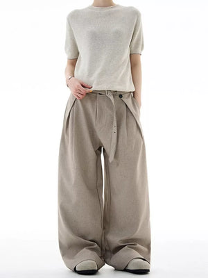 Tailored plus size wide-leg sweatpants in khaki with a belted waist and pleats.