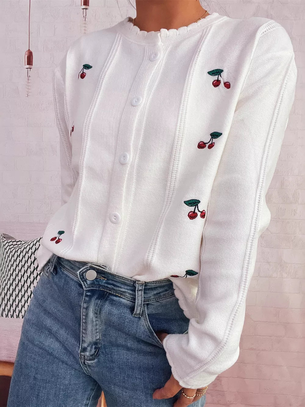 White button up cardigan with cherry embroidery and ruffled neckline.