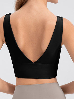 Black performance crop top with deep V-back and wide band