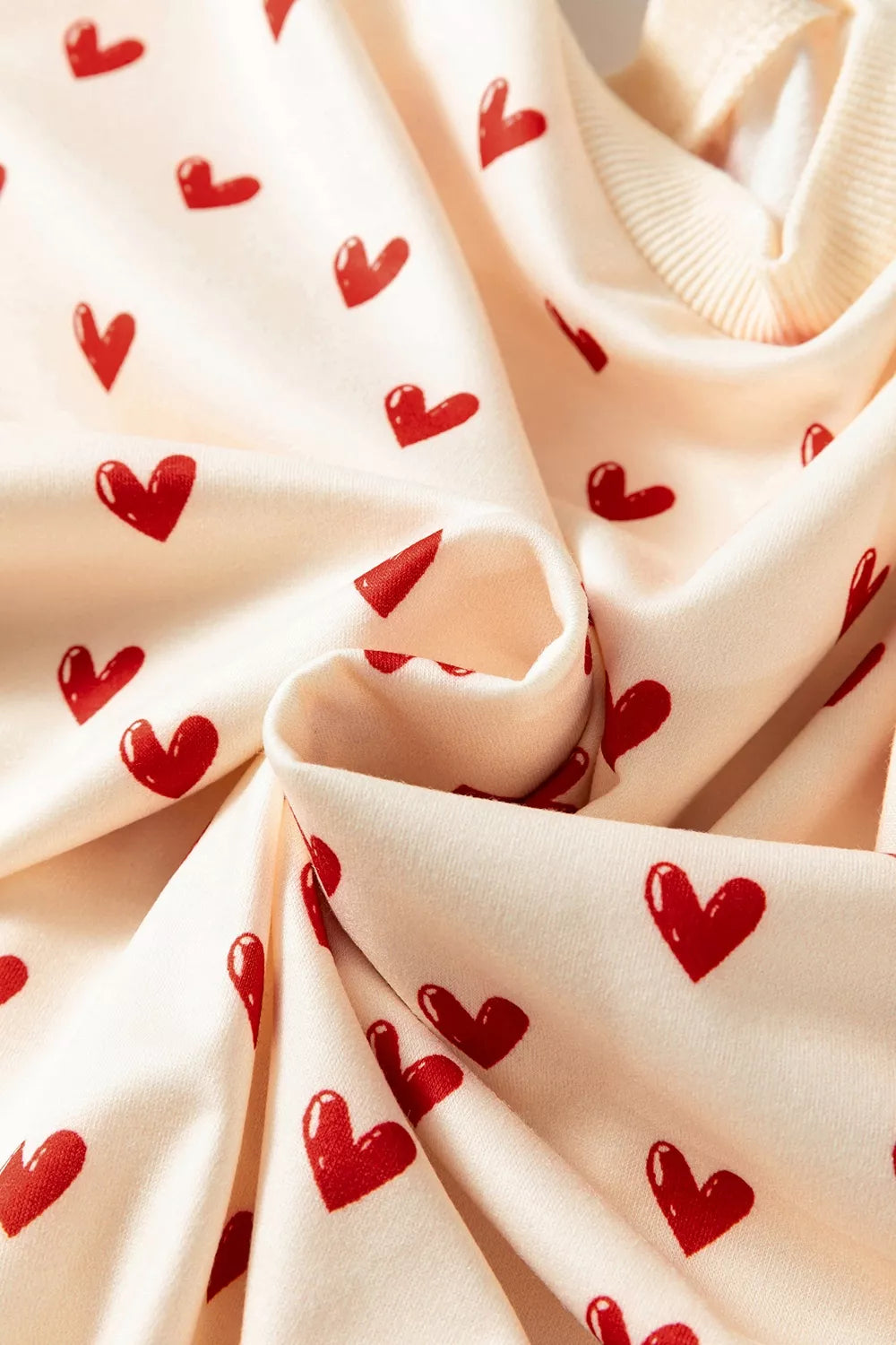 Heart Print Round Neck Long Sleeve Sweatshirt in Cream, fabric detail