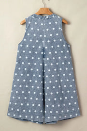 Denim polka dot romper with a tie-front detail and a high neckline.