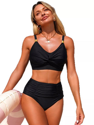 Black twisted front bikini top with gold strap details and ruched high-waisted bottoms.