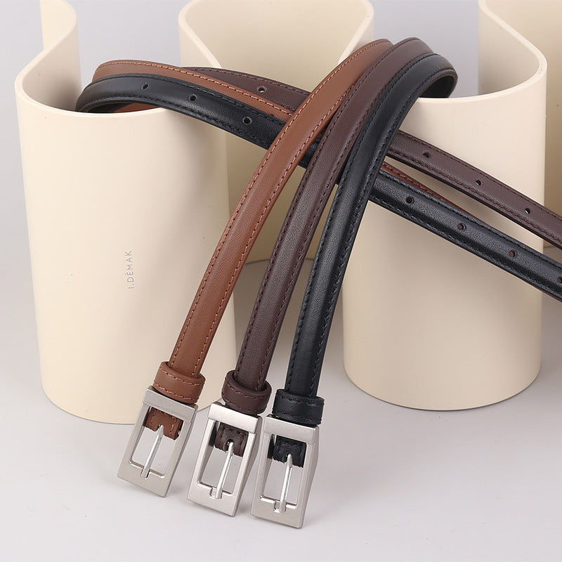 Premium cowhide leather belts in black, brown, and caramel with metal buckles.