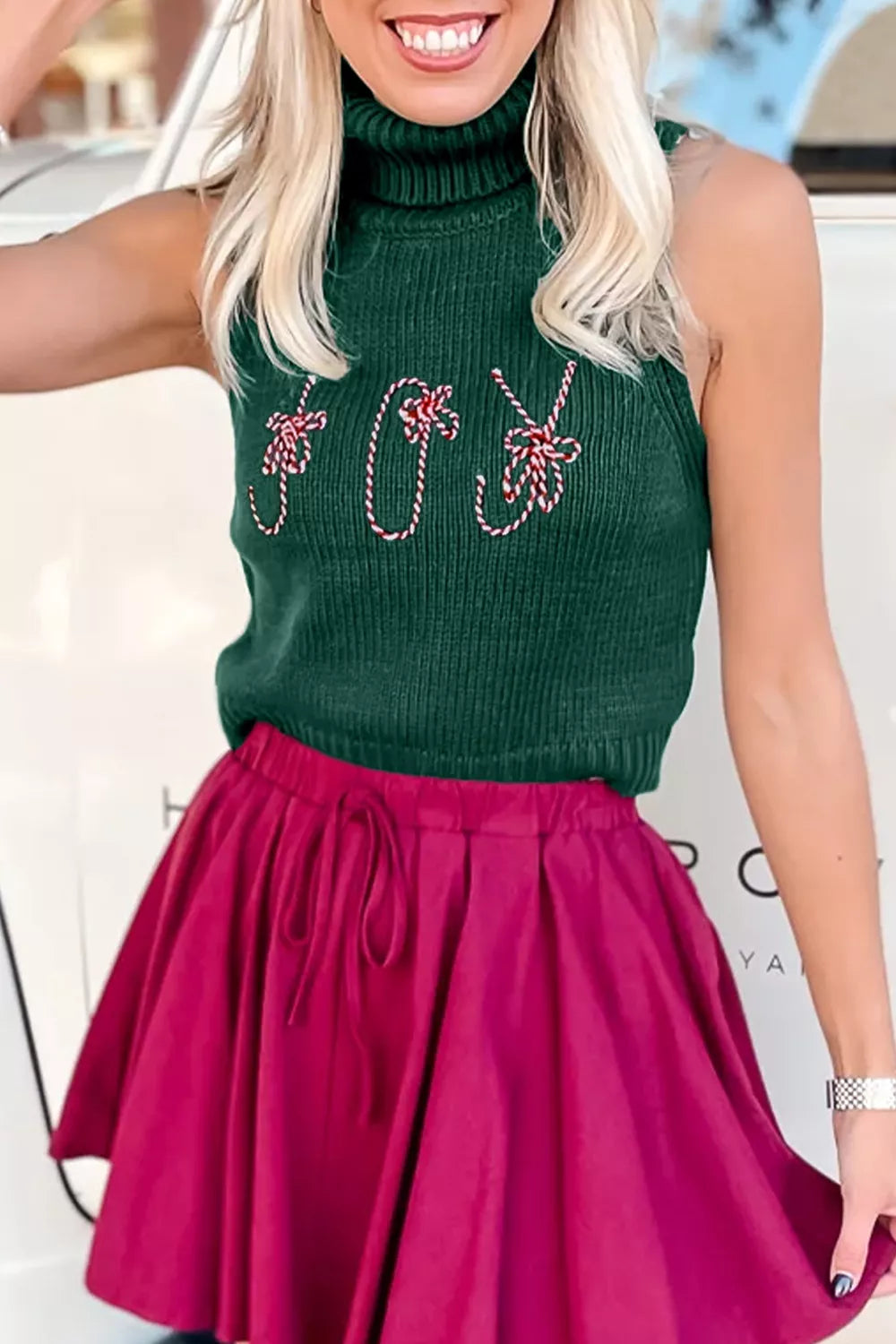Festive Candy Cane Embroidered Turtleneck Sweater Vest in Dark Green, model styling view
