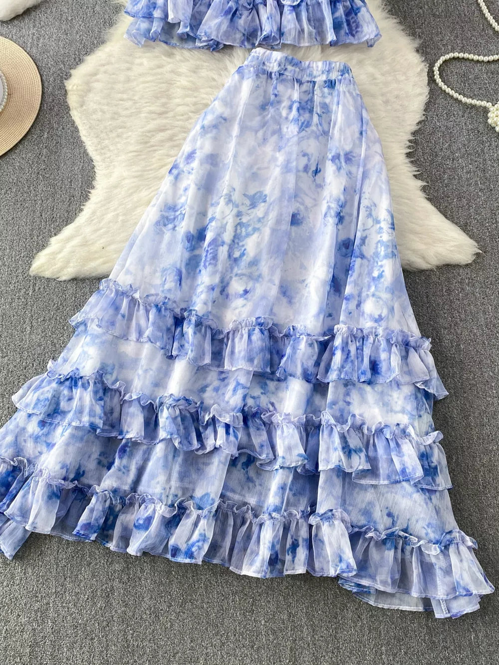 Sky blue floral ruffle bikini set with bow detail.
