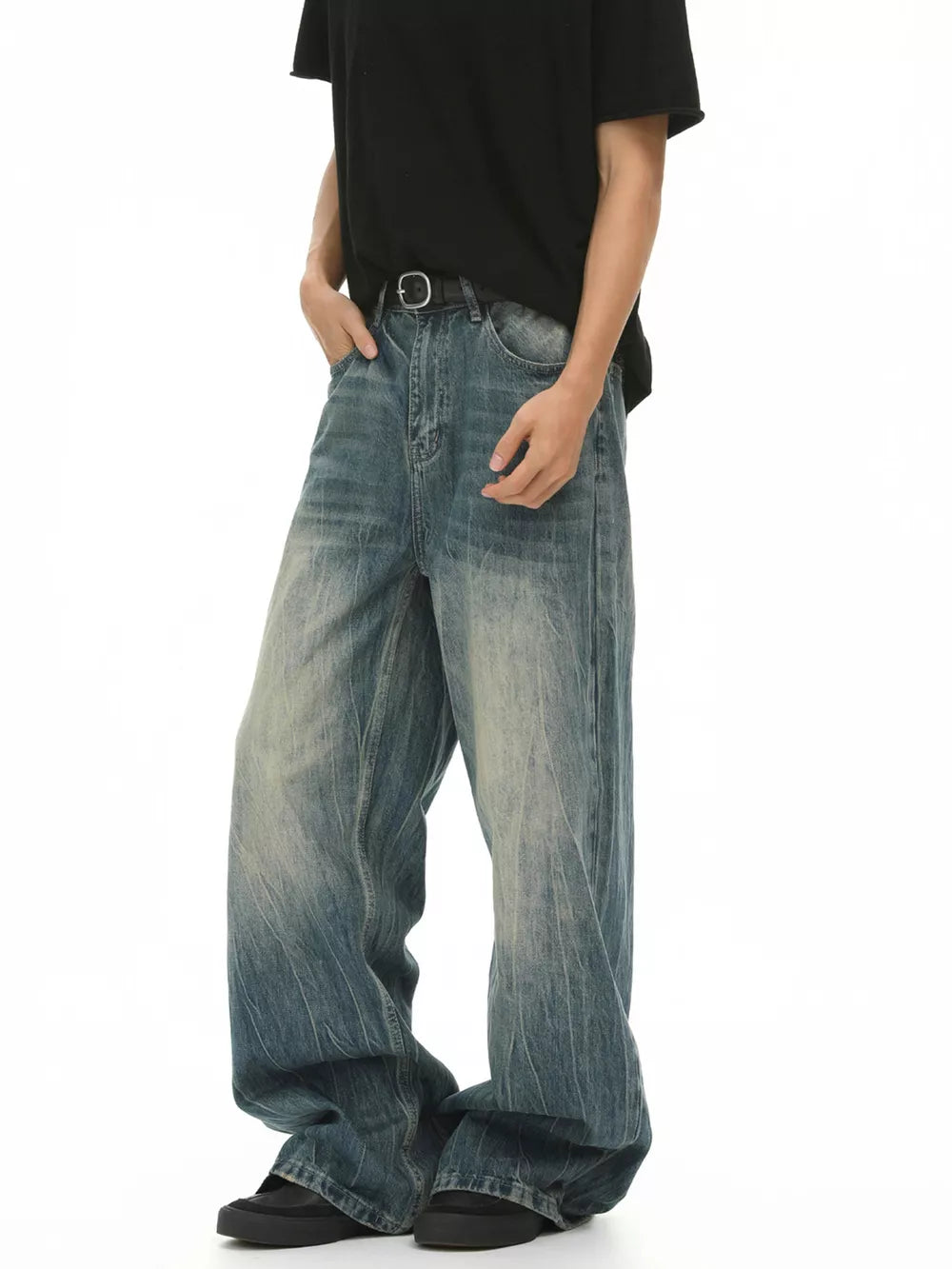 Men's blue baggy fit denim jeans with a faded wash and relaxed cut.