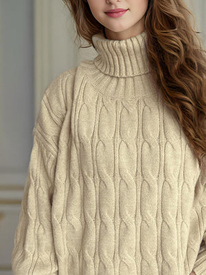 Oversized beige cable knit turtleneck sweater with ribbed collar and cuffs.
