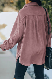 Fleece shirt jacket in Blush Pink with patch pockets and button cuffs.