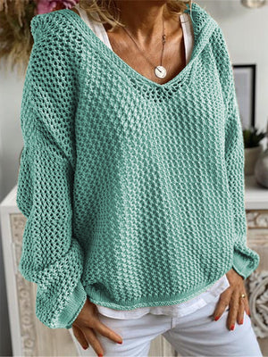 Turquoise open-knit slouchy hooded sweater with a deep V-neck and long sleeves.