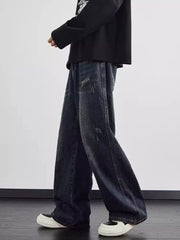 Men's dark wash wide leg jeans with distressed details and a relaxed fit.