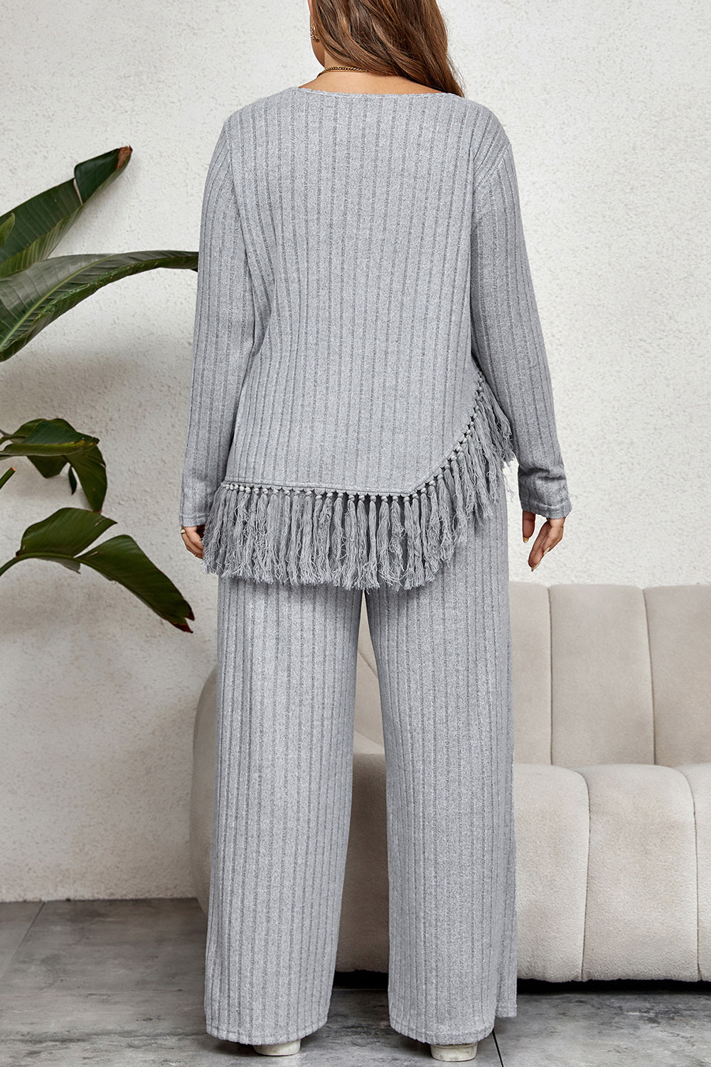 Ribbed lounge set with fringe hem detail in grey, featuring wide-leg pants and a long-sleeve top.