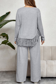 Ribbed lounge set with fringe hem detail in grey, featuring wide-leg pants and a long-sleeve top.