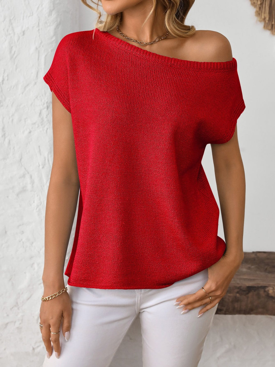 Off-the-shoulder knit tee in deep red with short sleeves and a boat neckline.