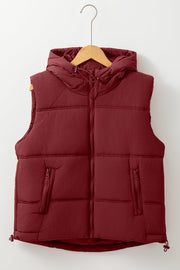 Burgundy quilted hooded puffer vest with zip pockets and adjustable drawcord hem.