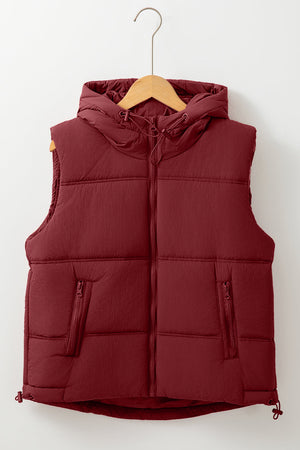 Burgundy quilted hooded puffer vest with zip pockets and adjustable drawcord hem.
