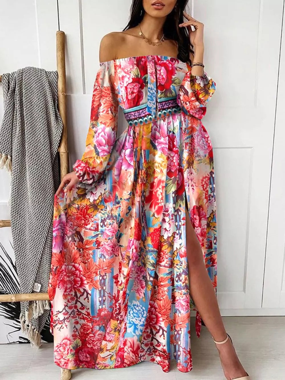 Vibrant floral off-shoulder maxi dress with balloon sleeves and a high slit.