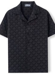Black embossed floral camp collar shirt with short sleeves and button front.