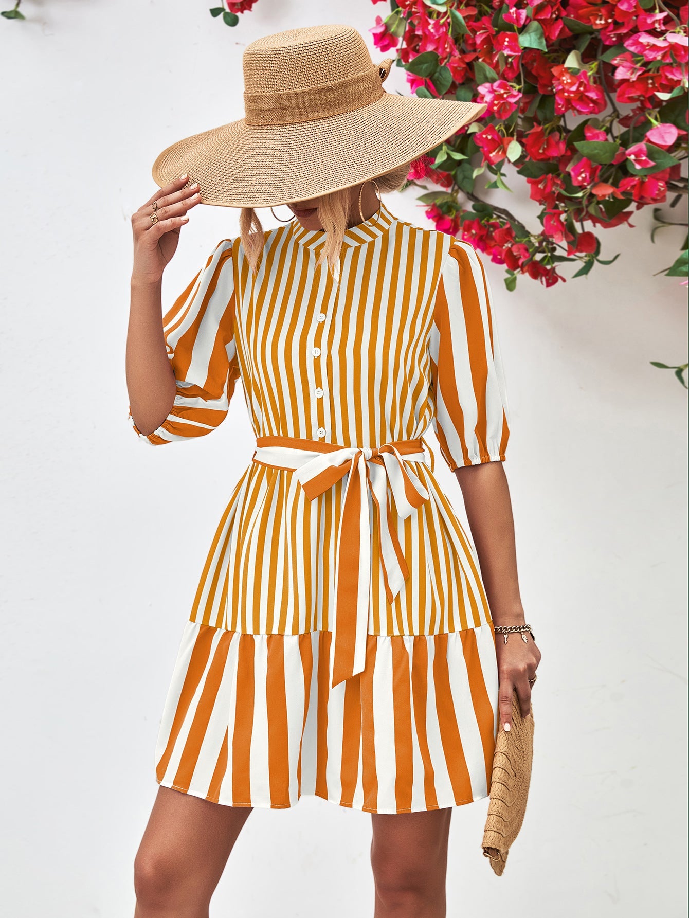 Vertical stripe shirred waist dress in gold with tie belt and tiered skirt.