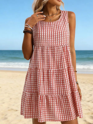 Red and white gingham tiered mini dress with a round neck and sleeveless design.